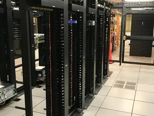 Large data hall with multiple rows of racks